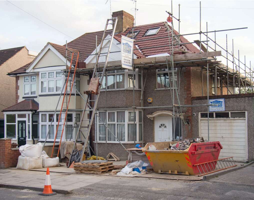 House under construction with scaffolding
